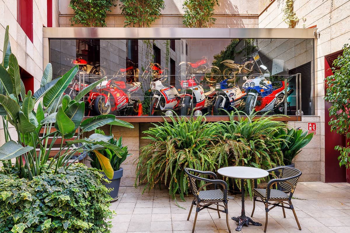 image of the green terrace with motorbikes expositor