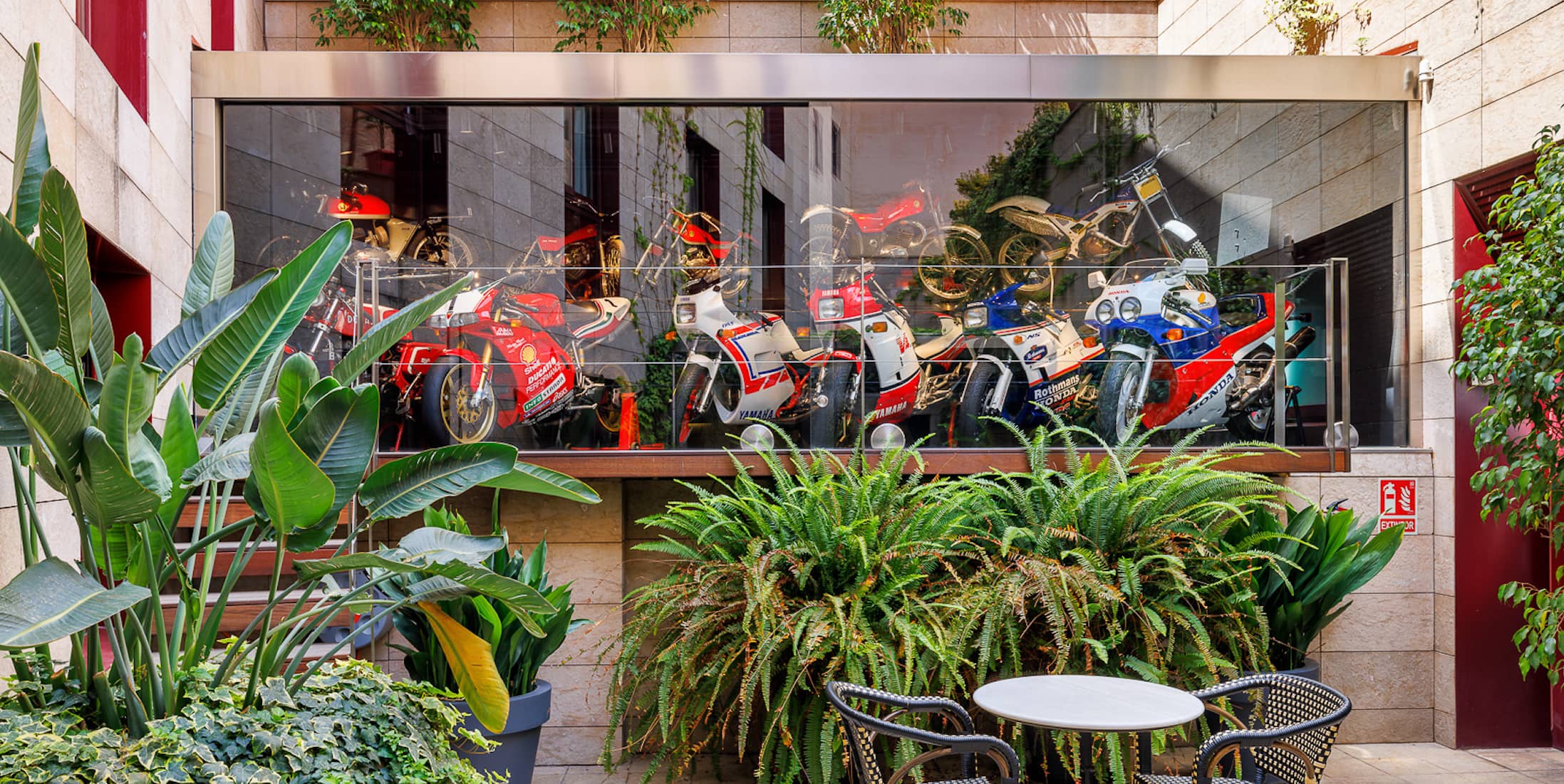 Image of the small inner terrace with motorbikes expositor
