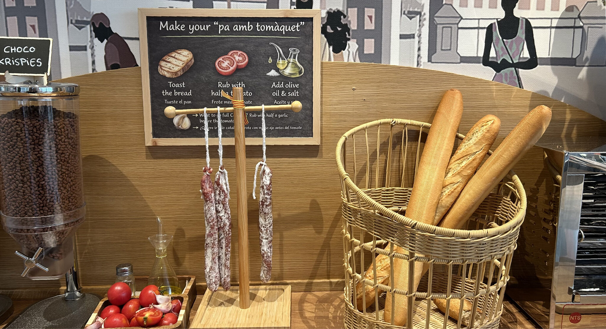 Bread corner with pa amb tomàquet station, fresh baguettes and cereals at the breakfast buffet, Hotel Ronda Lesseps, Gràcia Barcelona