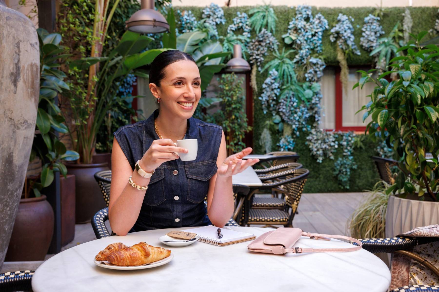 Guest enjoying coffee on the green terrace at La Terrasseta del Lesseps, Gràcia Barcelona